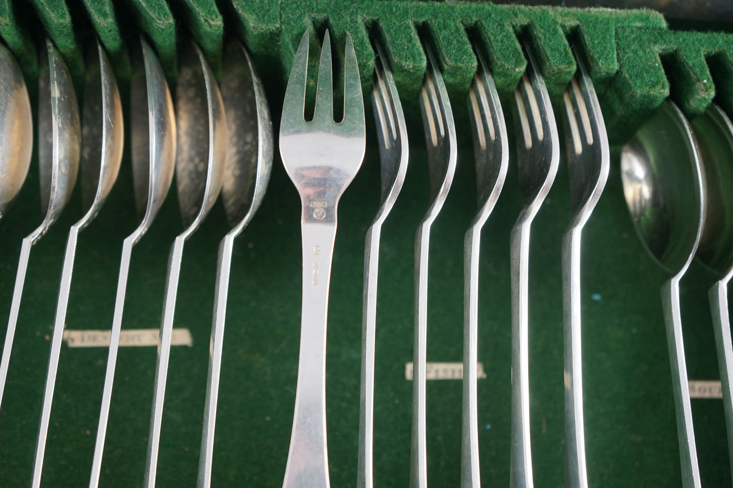 An early 20th century Georg Jensen canteen of beaded pattern silver cutlery